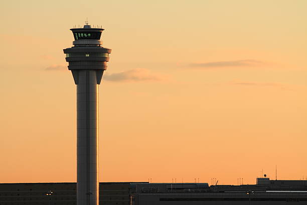 Airport control tower at tokyo international airport (at dawn) Airport control tower at tokyo international airport (at dawn) air traffic control tower stock pictures, royalty-free photos & images