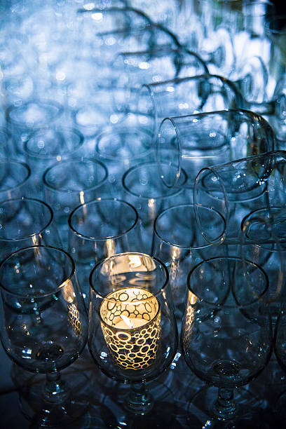 istock The candle in wineglasses in a bar - abstract composition 514832472
