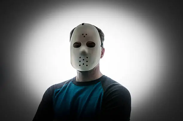 Photo of Man with a hockey mask looking like a serial killer