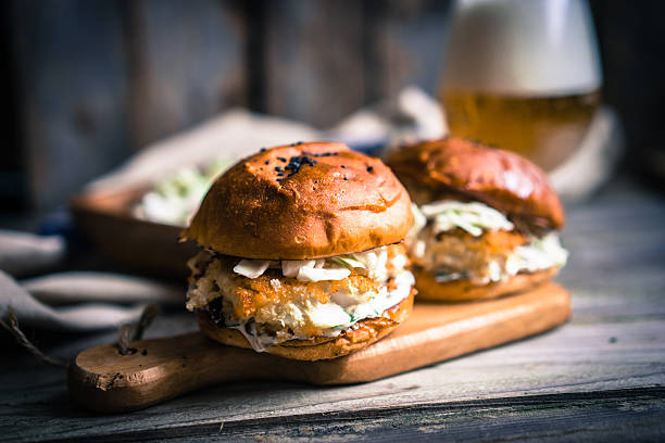 istock Rustic fish burgers with coleslaw and beer 514832842