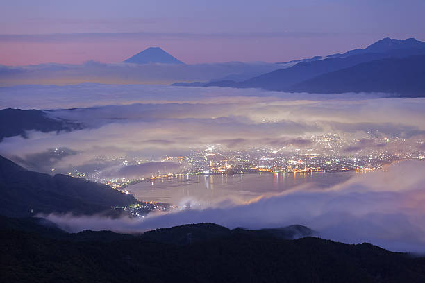Mountain Fuji and lake suwa at sunrise Beautiful Mountain Fuji and lake suwa at sunrise time in autumn season seen from Mt. Takabocci suwa lake photos stock pictures, royalty-free photos & images