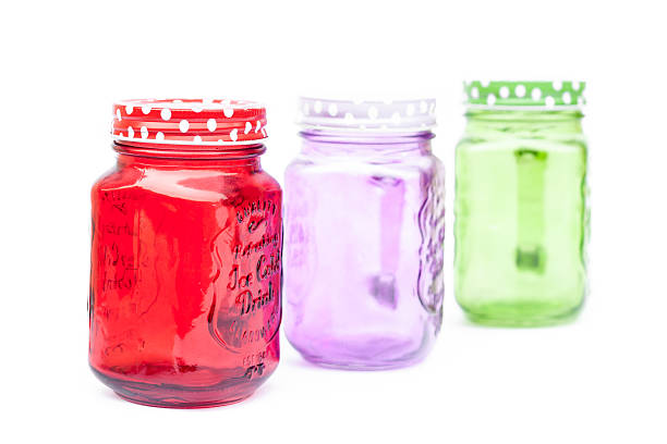 istock Colourful mason glasses on white background 514834288