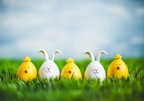 Photo of Little Easter critters sitting in grass with big blue sky