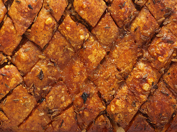 istock rustic scored golden roasted pork belly skin background 514837998
