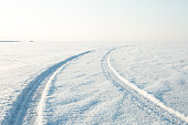 snow desert and the tracks of the car in snow