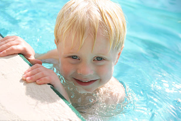 istock Cute Smiling Toddler in Swimming Pool 514838308