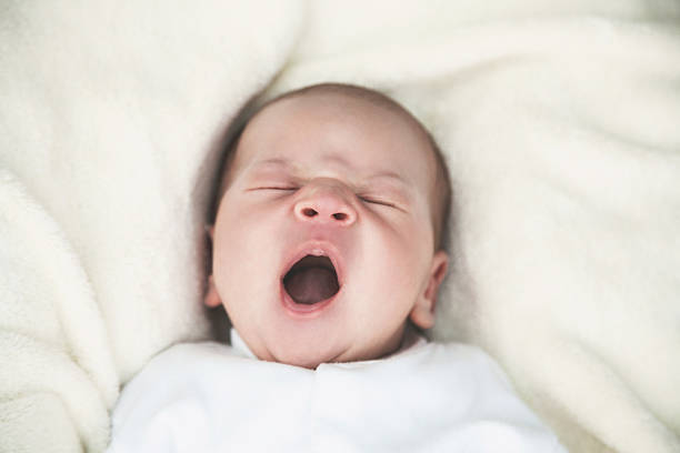 istock Newborn baby yawning 514840372
