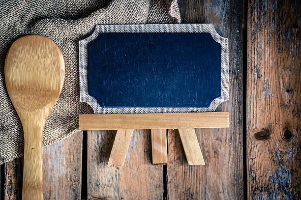 istock Wooden kitchen utensils and board on wood background 514841074