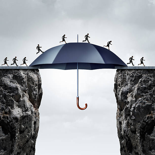Security Bridge Concept Security bridge concept as business people running across two high cliffs with the help of a safe giant umbrella bridging the gap. bridging the gap stock pictures, royalty-free photos & images