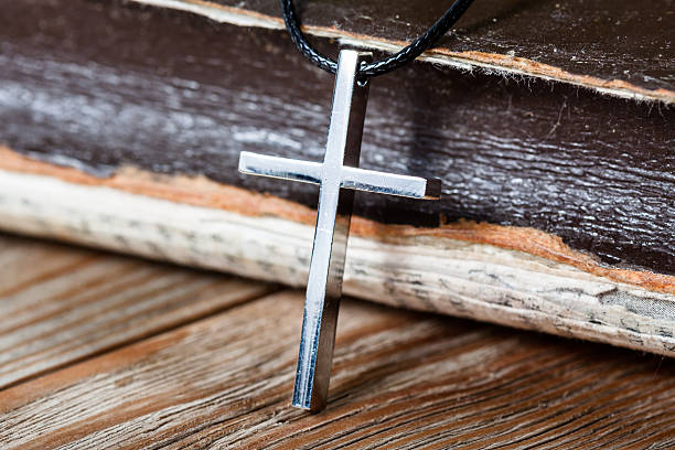 istock Silver Christian cross on bible 514843944