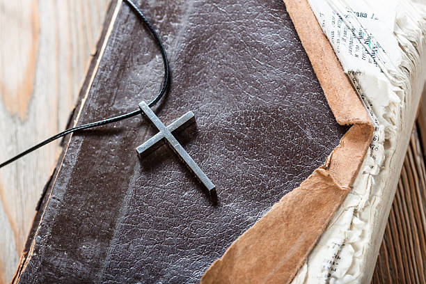 istock Silver Christian cross on bible 514843992