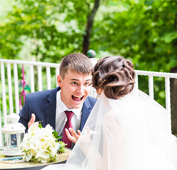 istock funny bride and crazy groom  on the restaurant terrace 514849096