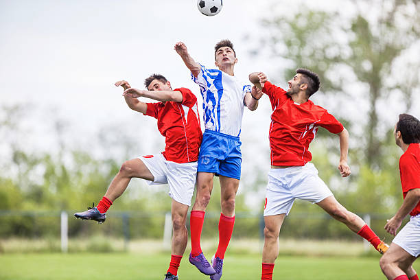 istock Soccer players heading the ball. 514852099