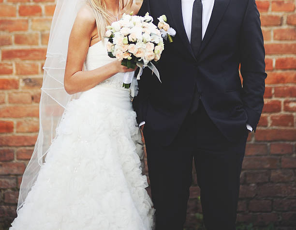 istock Newly wed couple holding hands. 514852315