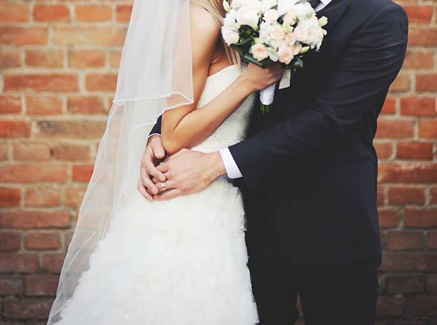 istock Newly wed couple holding hands. 514852317