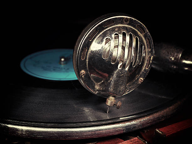 istock Head with an old gramophone needle on the vinyl disc 514853369