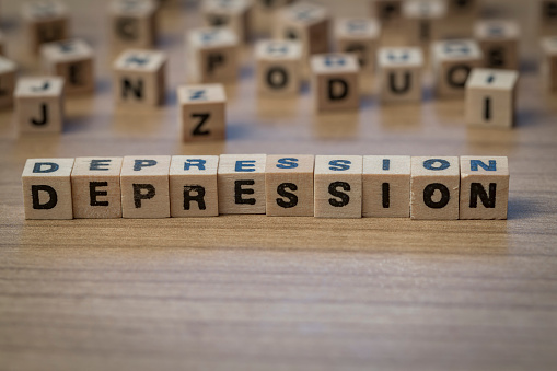 Depression written in wooden cubes on a table