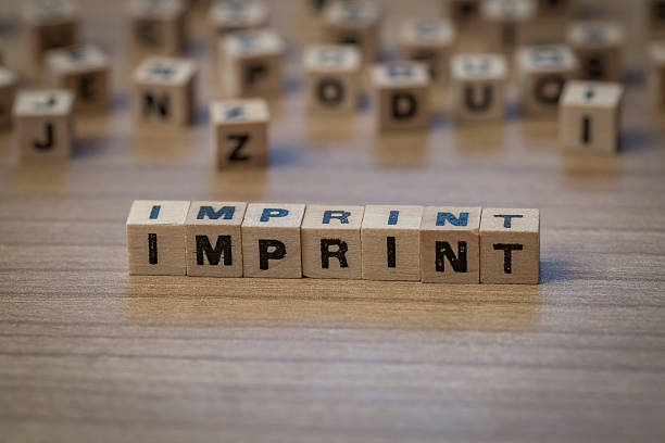 istock Imprint written in wooden cubes 514855128