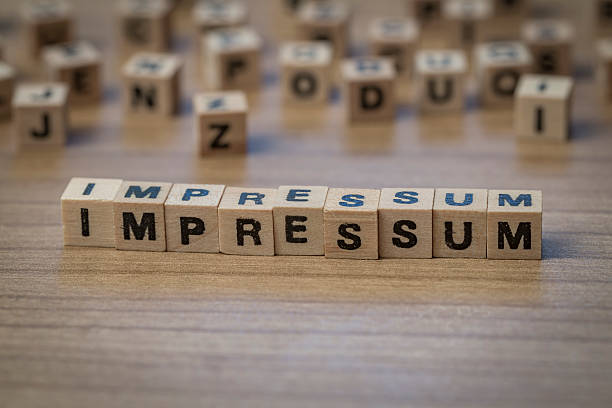 istock Impressum written in wooden cubes 514855166