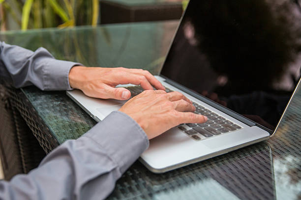 istock Adult male using laptop for work 514855216