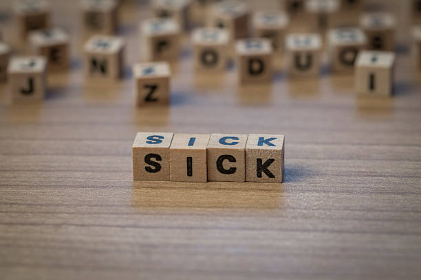 istock Sick written in wooden cubes 514855612