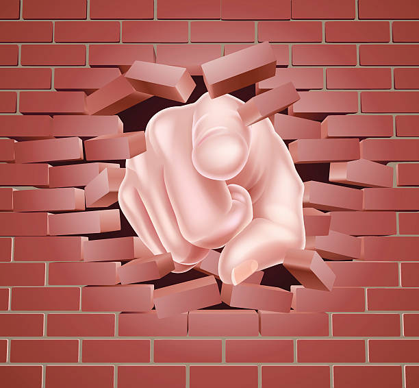 Pointing Hand Breaking Red Brick Wall Hand pointing bursting through a red brick wall uncle sam broke stock illustrations