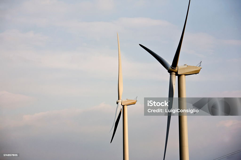 Sustainable energy View of aeolic mills in a  sunset sky. Choice Stock Photo