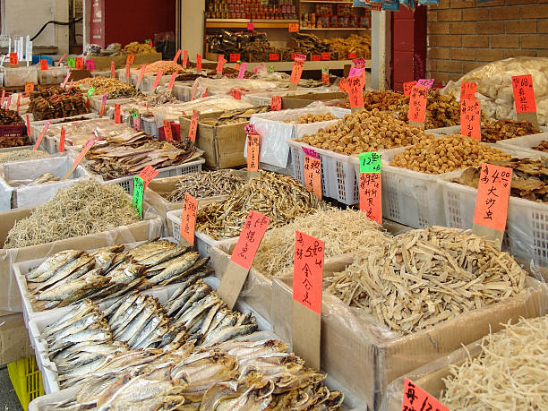 istock Fish Market with open bins dried seafood. 514857943