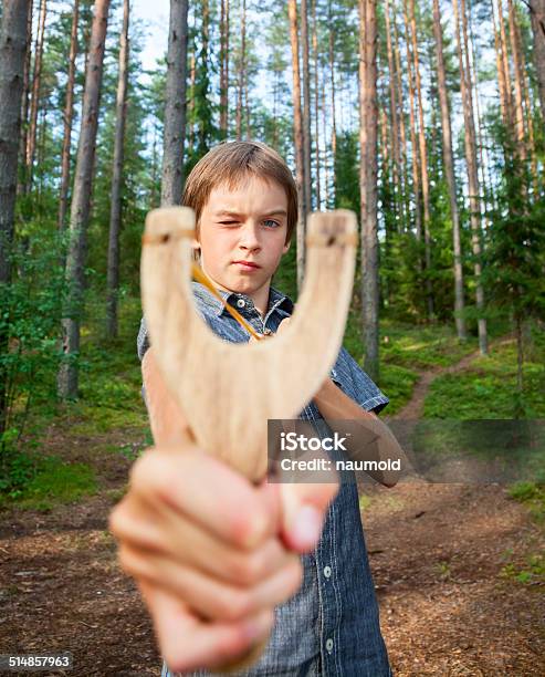 Kid With Slingshot Stock Photo - Download Image Now - Rudeness, Accuracy, Activity