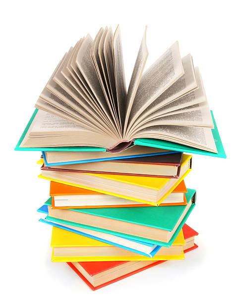 istock The open book on a pile of multi-coloured books. 514858667