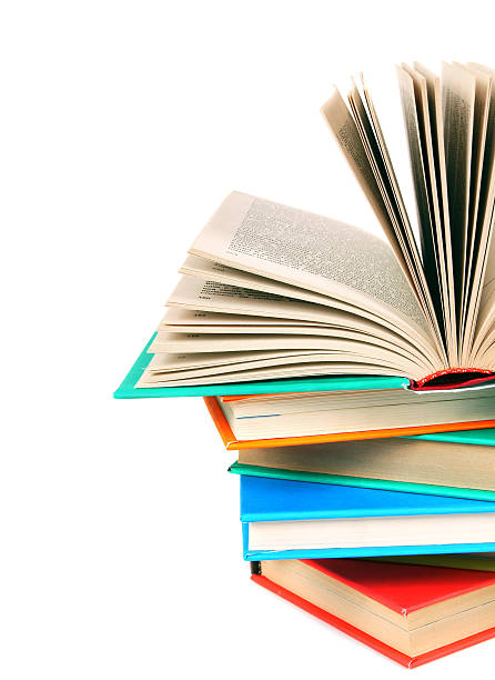 istock The open book on a pile of multi-coloured books. 514858671