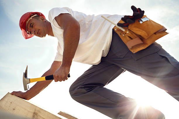 istock Construction roofer nailing wood board with hammer 514859073