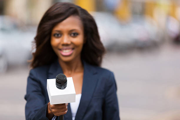 istock young african female journalist interviewing 514859757