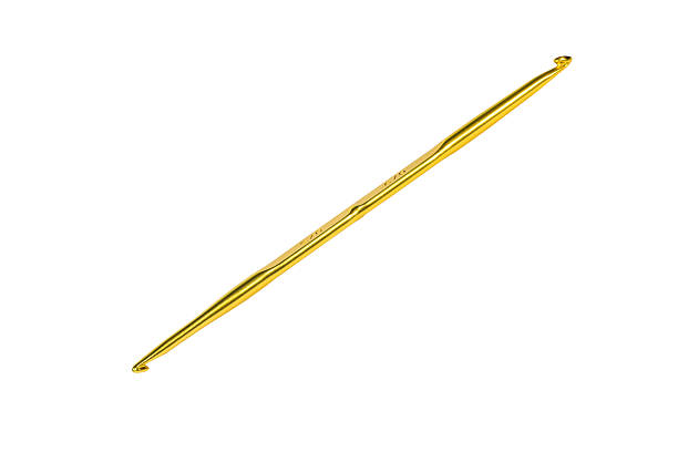 istock Golden crochet hook isolated on white 514859831