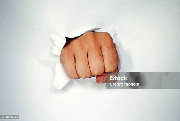 Fist Breaking Through A White Paper Isolated On White Stock Photo - Download Image Now