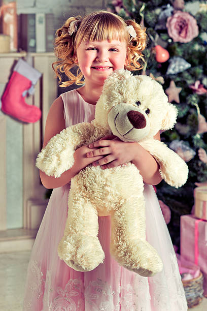istock Beautiful little girl with Christmas gift 514876251