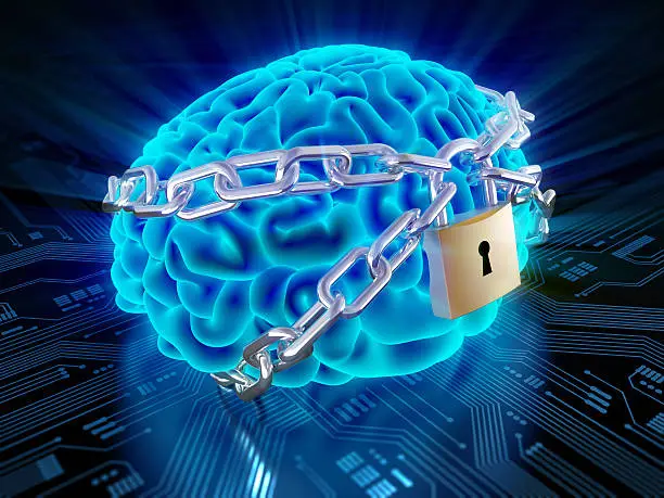 Photo of Chained brain with lock on circuit board