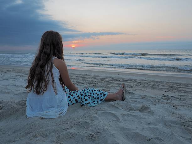 istock Little Girl On Beach At Sunrise 514879473