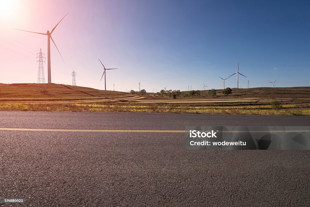 Road Running Through the windmill Fields Roadside Stock Photo