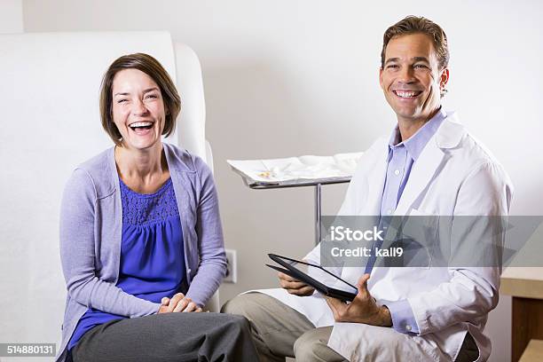 Doctor And Patient Stock Photo - Download Image Now - Doctor's Office, Patient, Sitting