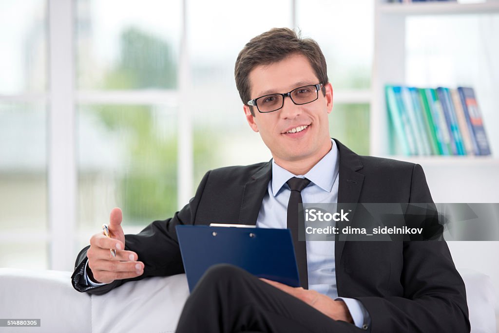 Portrait of male psychologist in office Portrait of a Portrait of male psychologist in office Adult Stock Photo