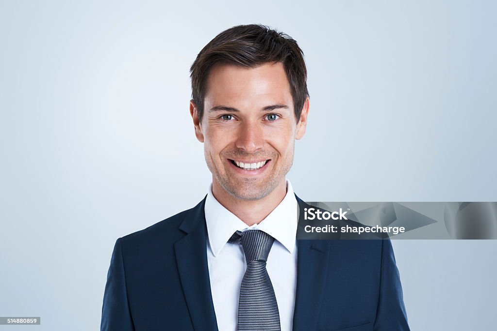 I create my own opportunities Studio portrait of a handsome young businessman against a gray background Men Stock Photo