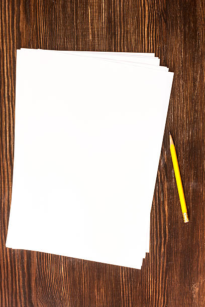 istock Pencil and white card on wooden desk 514882311