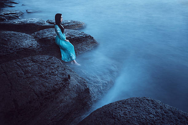 istock Beautiful young woman on sea 514909519