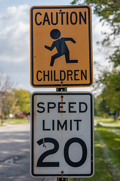 istock Children Playing/Speed Limit Street Sign 514909919
