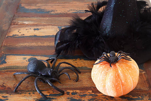 istock Halloween background:  pumpkins,  hat of witch, spider 514910583