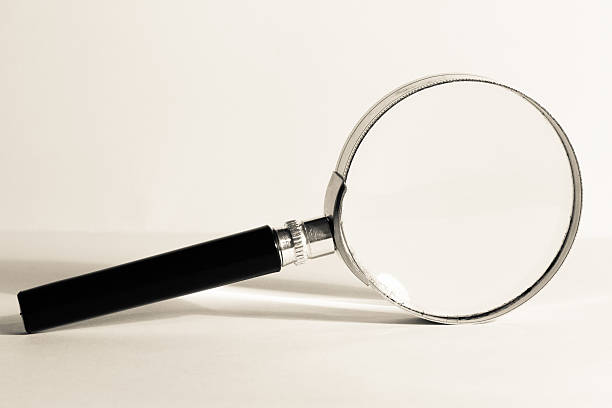 istock magnifiying glass photo on white 514911459