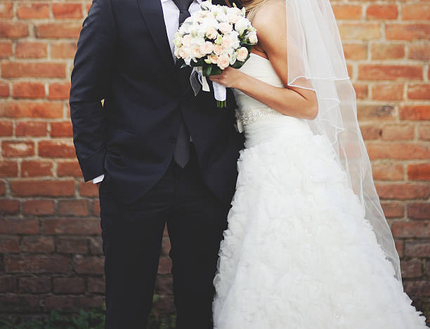istock Newly wed couple holding hands. 514911935