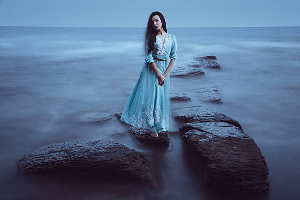 istock Beautiful young woman on sea 514912897