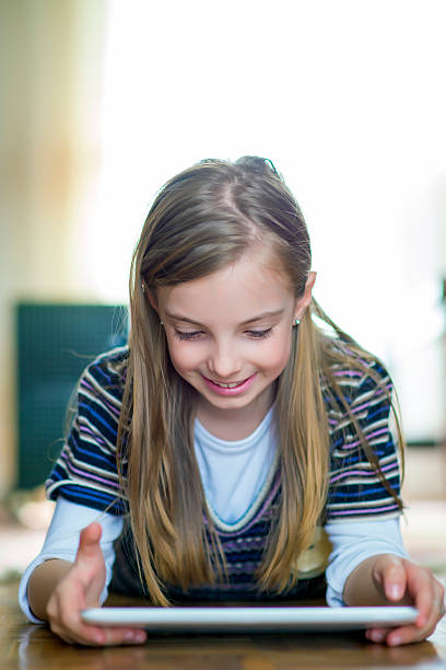 istock Little girl and a tablet 514913602